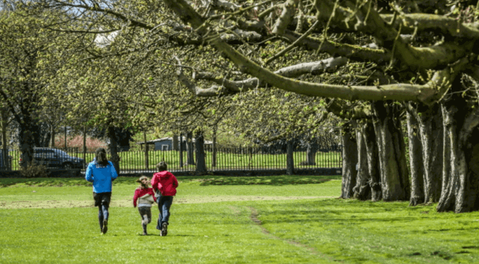 People running in a field