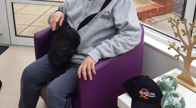 Person sitting in a purple chair