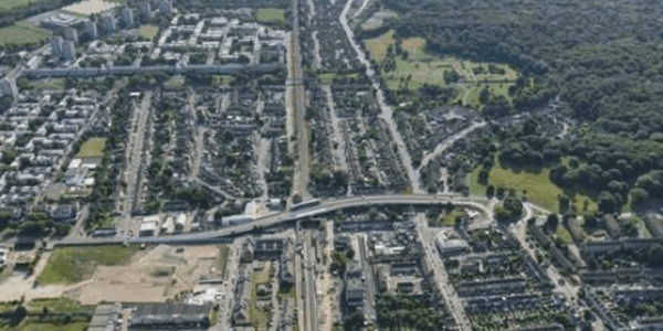 Birds-eye view of an outdoor area with trees and roads