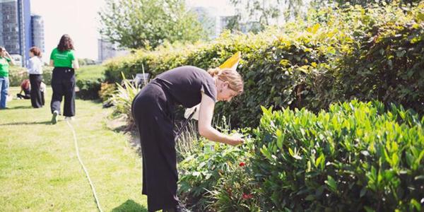 Lady with plants outside